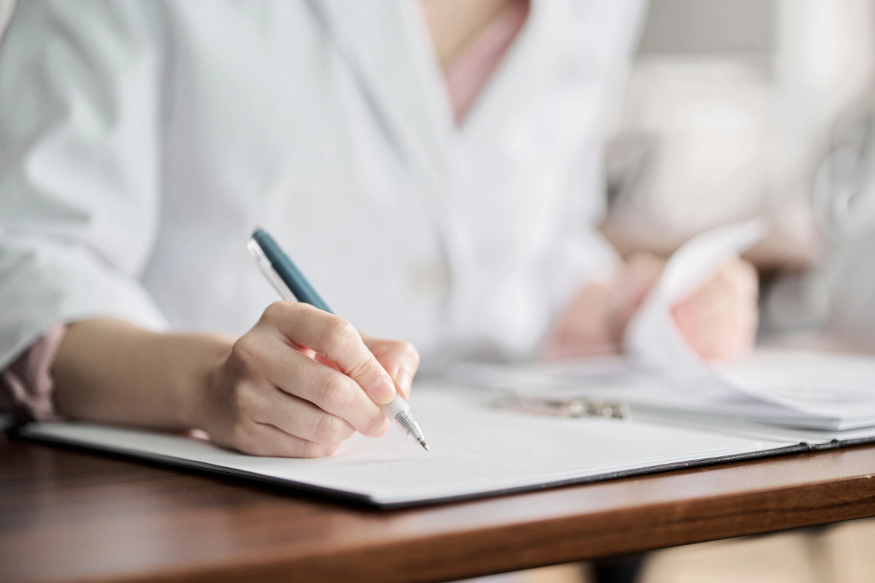 Financial Planning for Physicians Stoic Wealth Advisors Physician reviewing financial planning documents during a personalized wealth management consultation