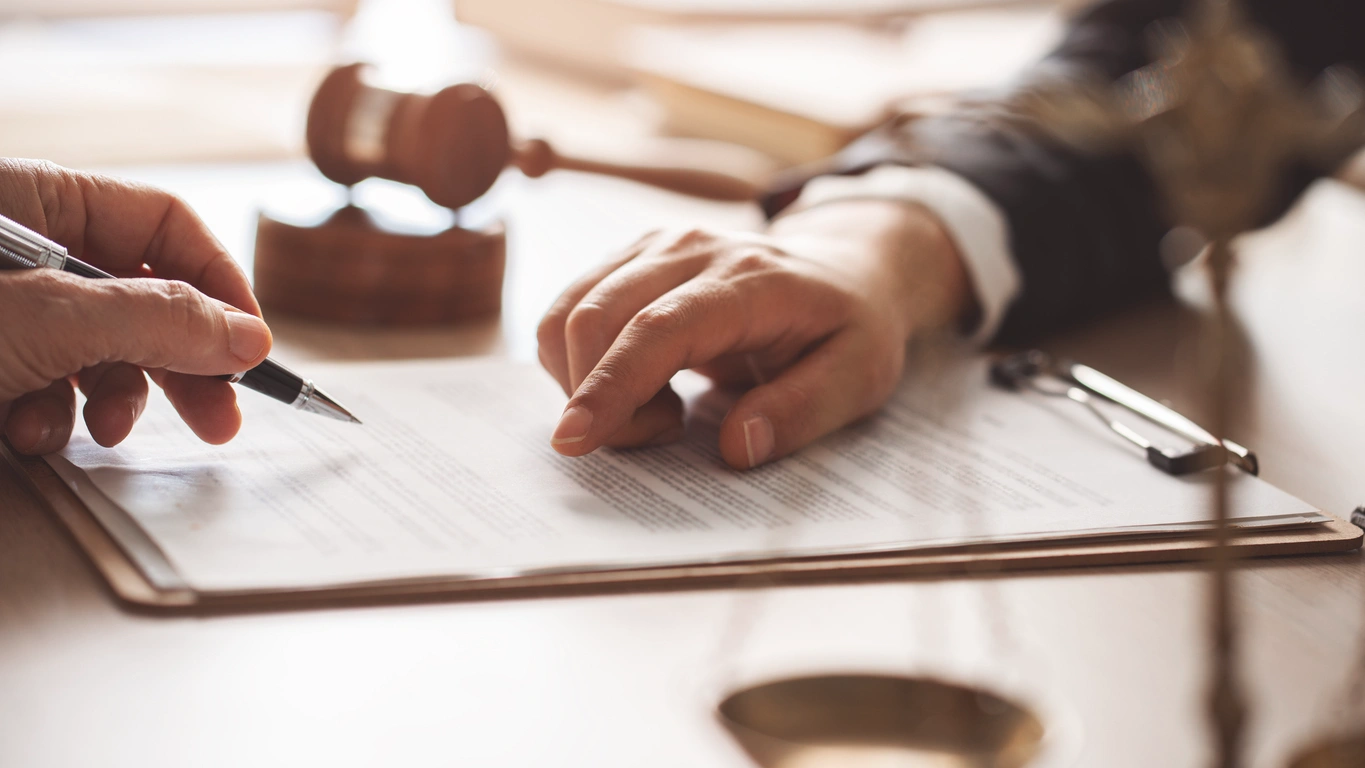 Trusted Estate Planning Strategies Stoic Wealth Advisors Advisor reviewing estate planning and legal documents during a legacy planning consultation